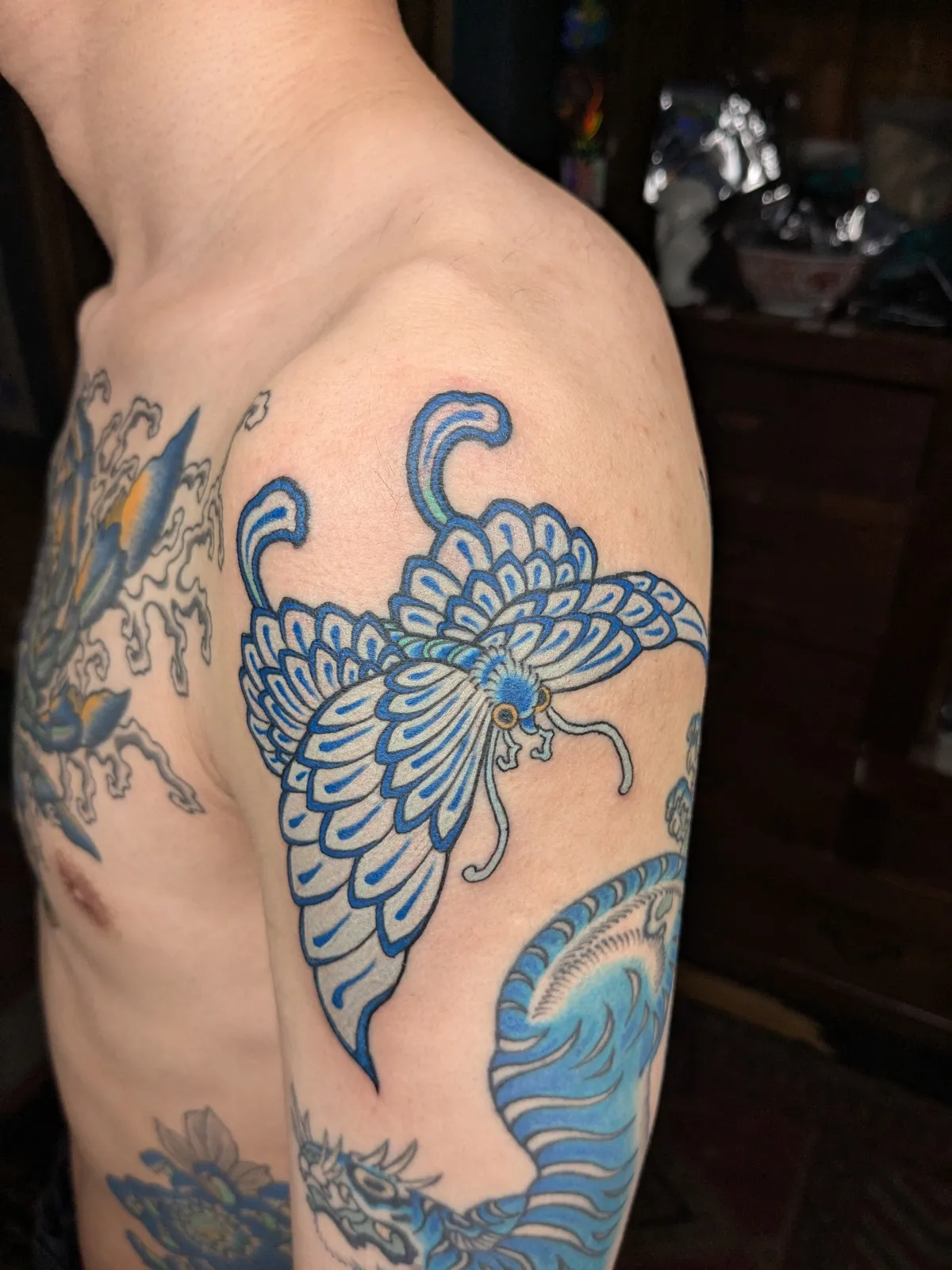 Butterfly tattoo on the upper arm