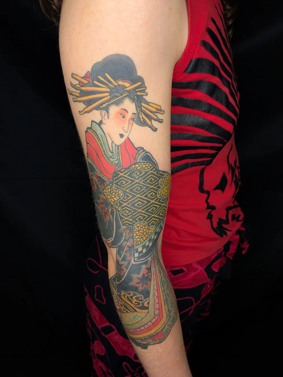 Kimono courtesan tattoo on the upper arm
