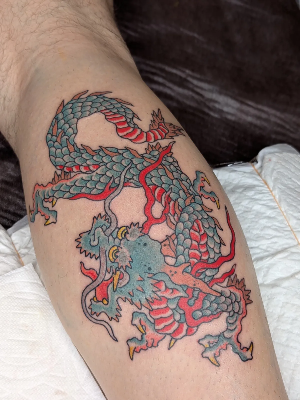 Dragon tattoo on the calf