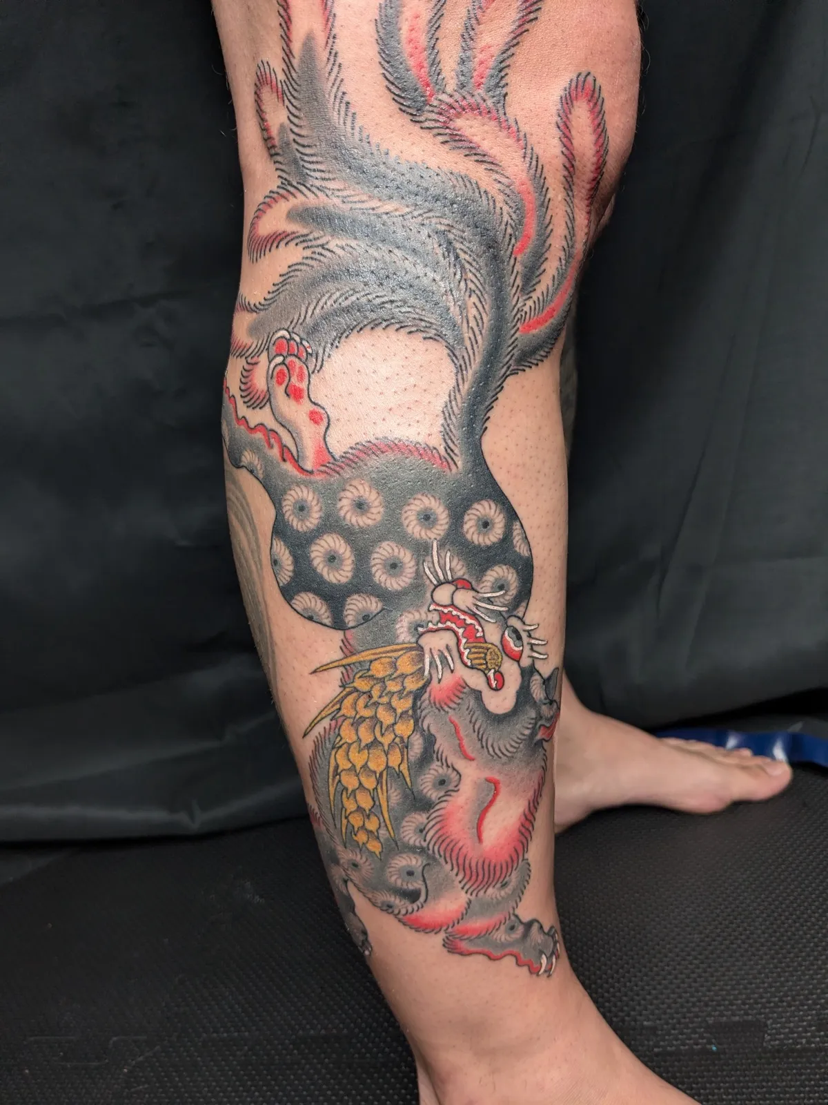 Nine-tailed fox tattoo on the calf