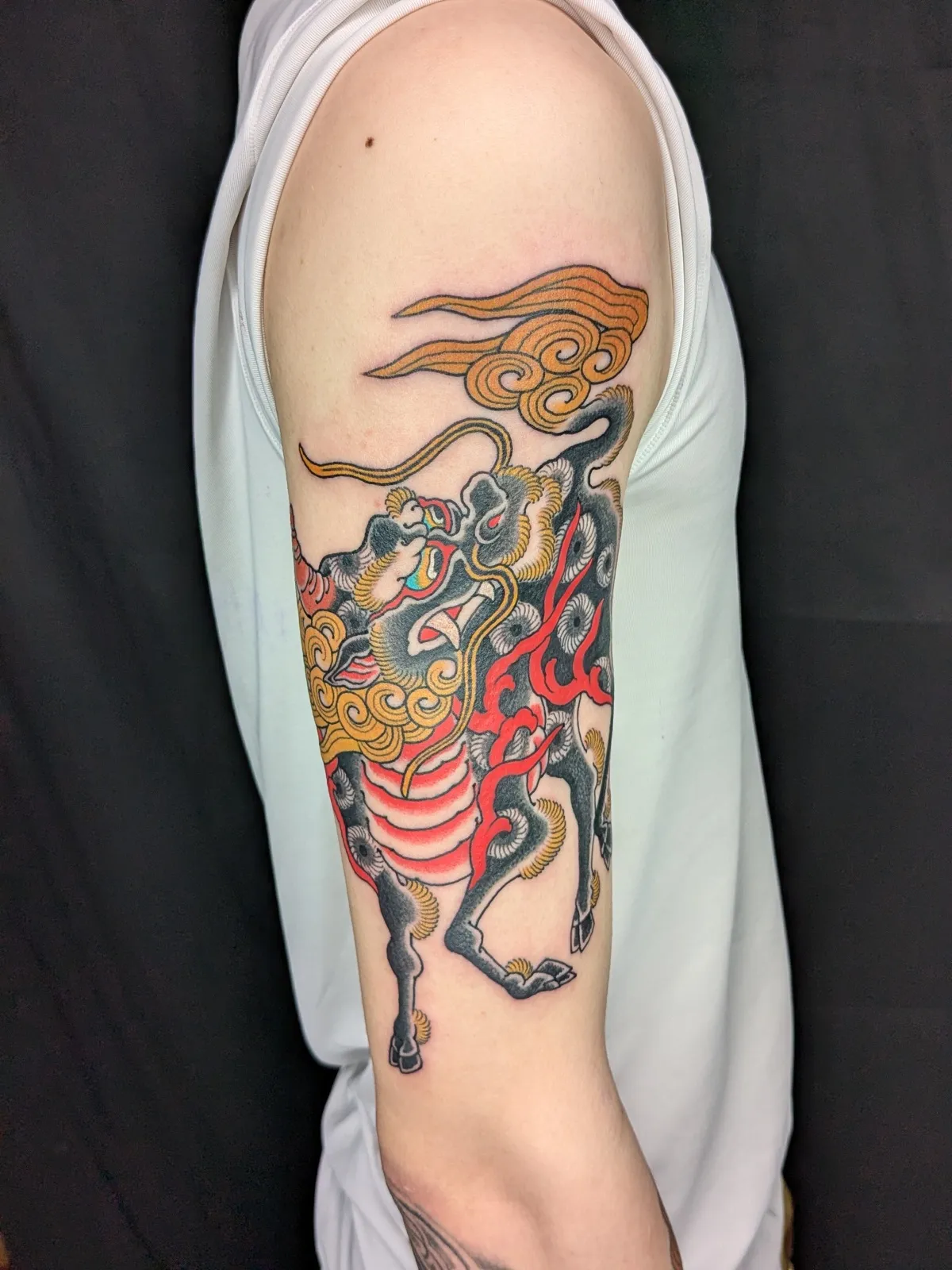 Kirin tattoo on the upper arm