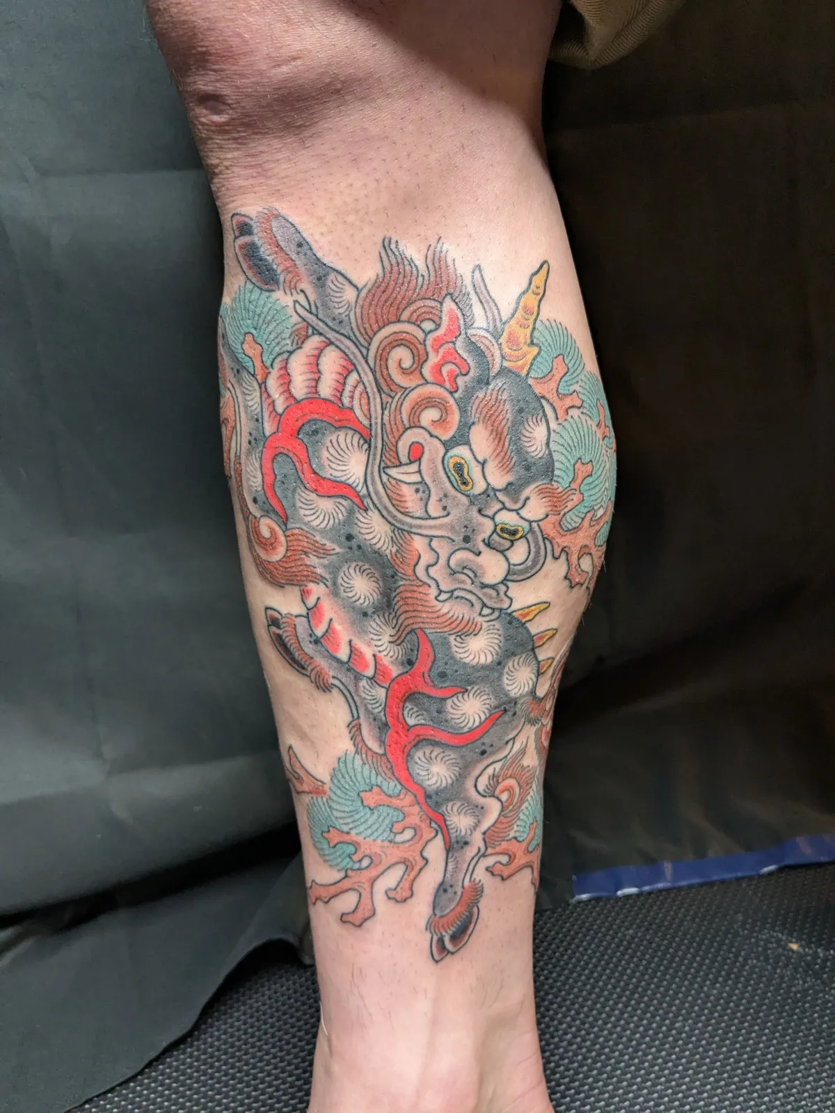 Kirin tattoo on the calf