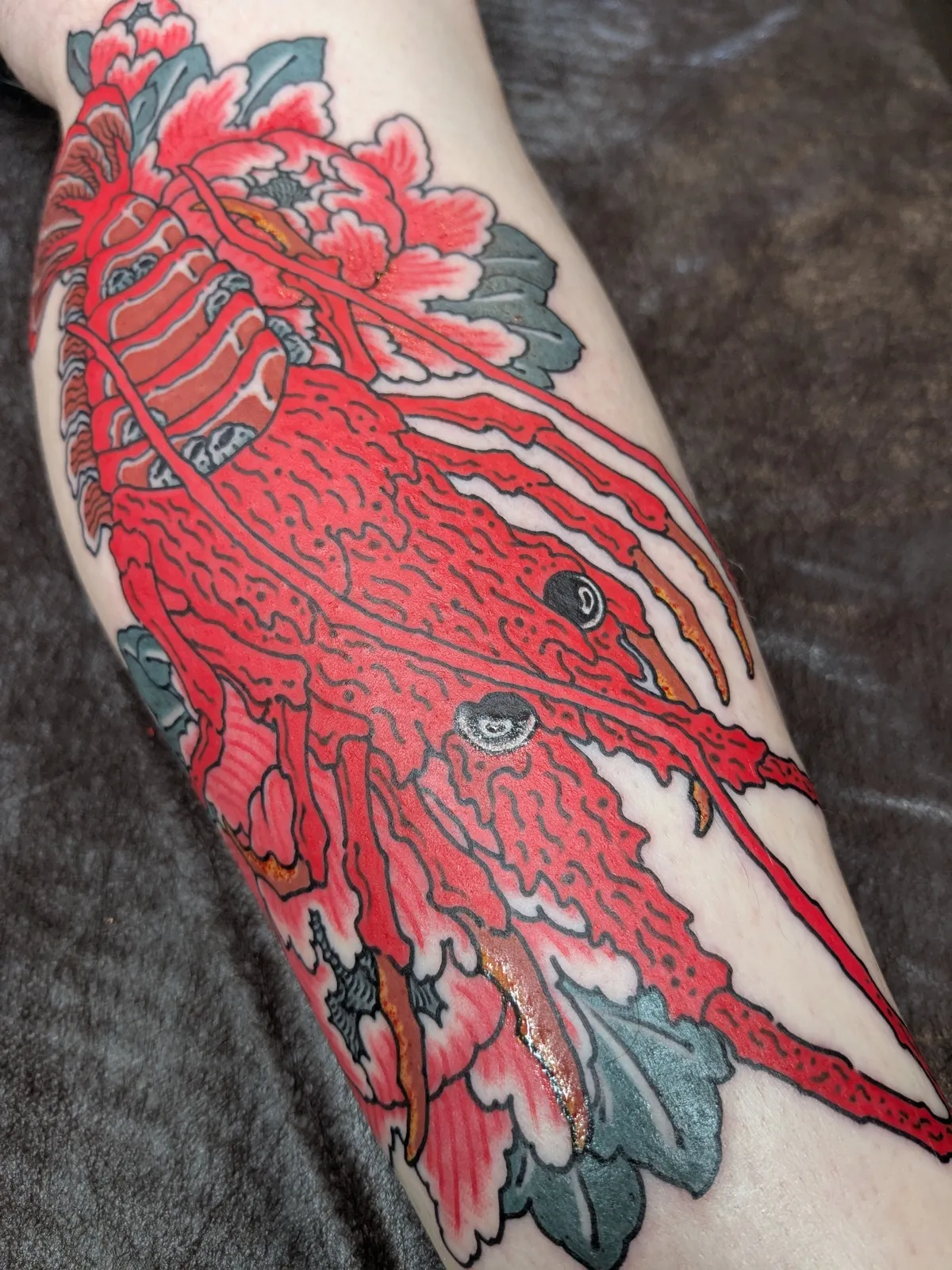 Lobster tattoo on the forearm