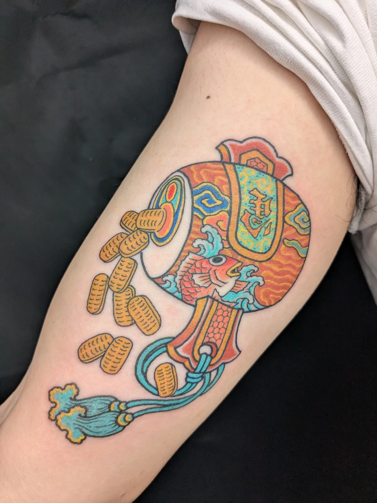 Mallet tattoo on the forearm