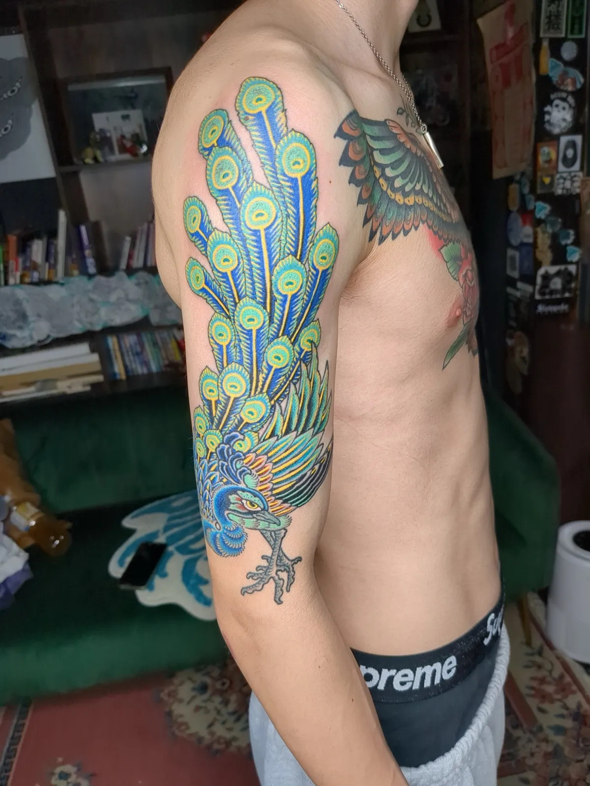 Peacock tattoo on the arm
