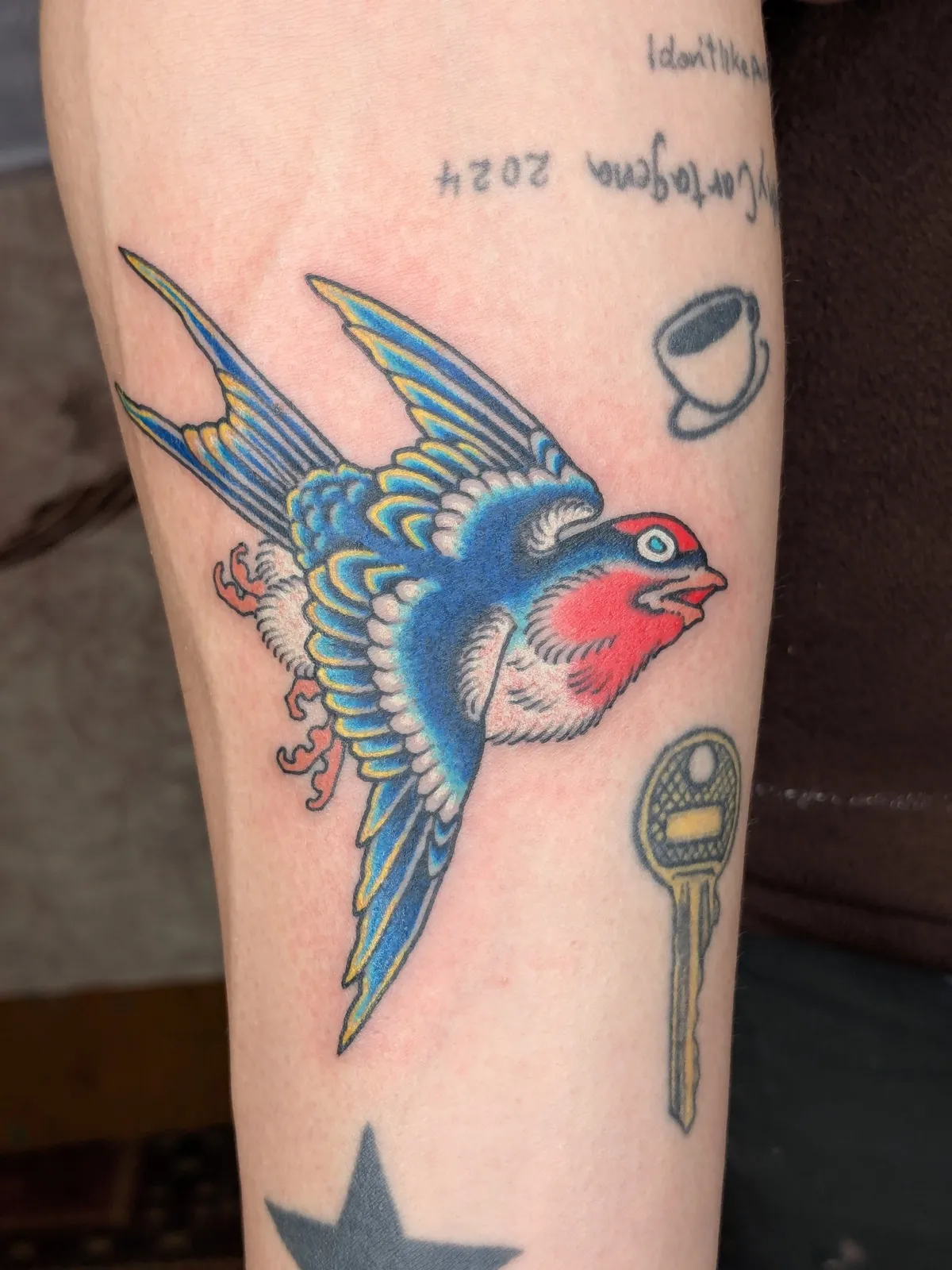 Swallow tattoo on the forearm
