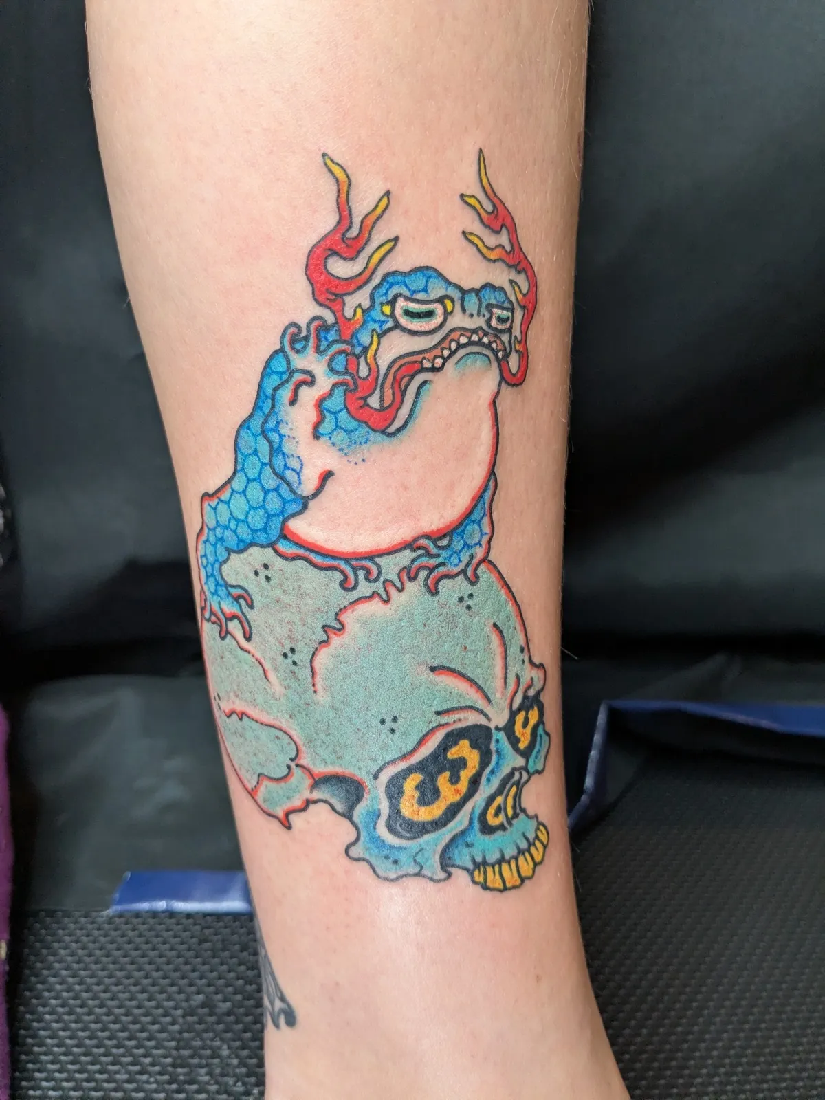 Toad tattoo on the calf