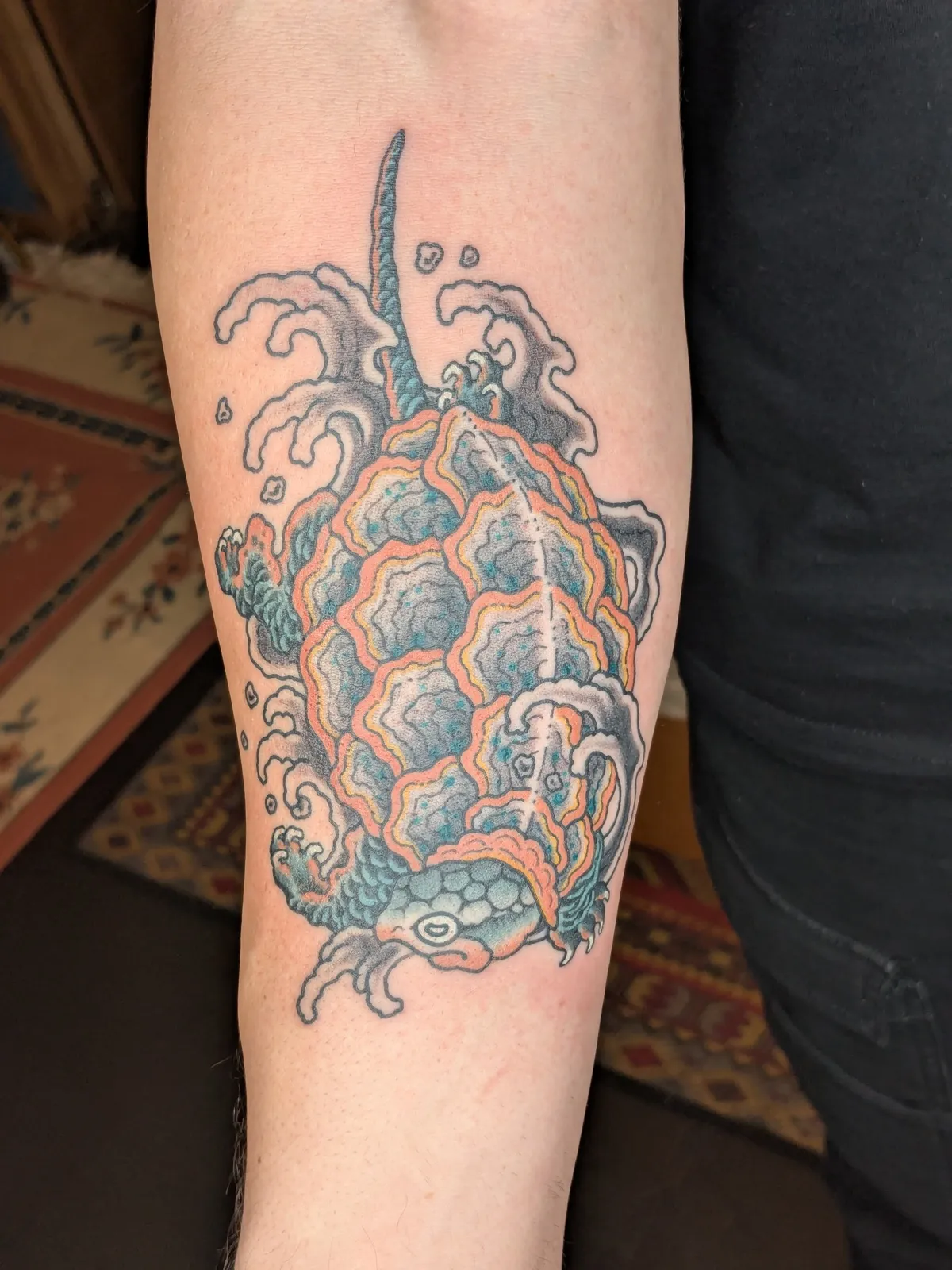 Turtle tattoo on the forearm